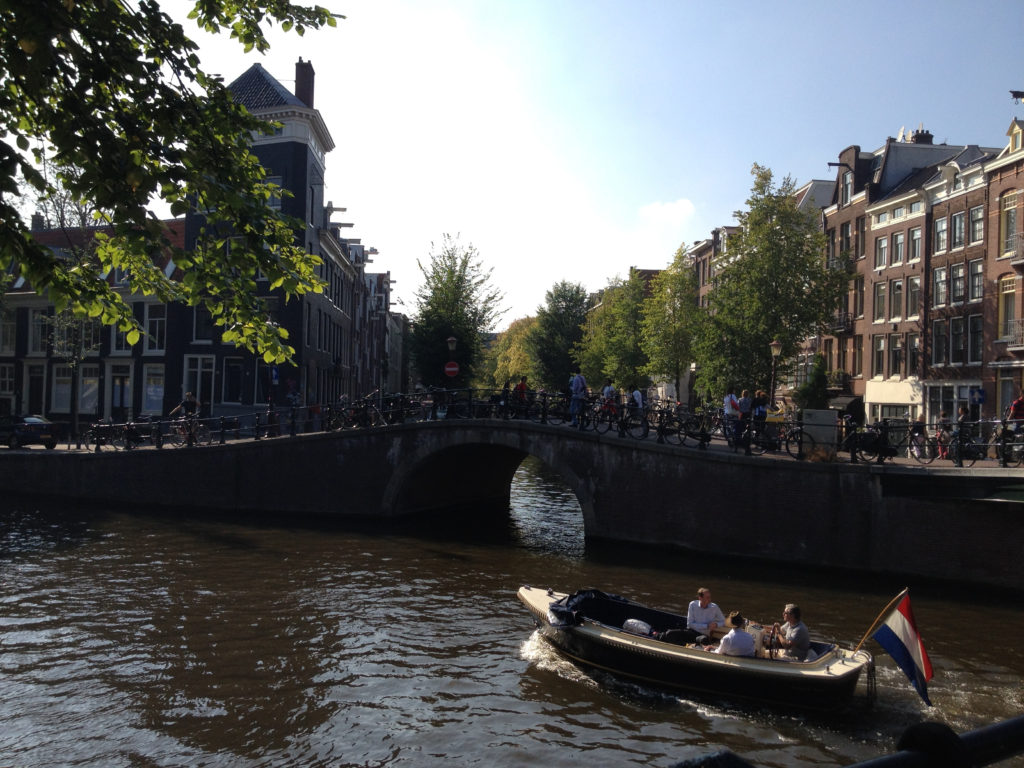 Boat on Amsterdam Canals – Photo by Jessica Lipowski (1)