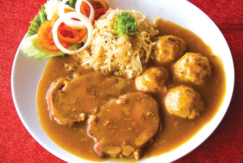Roast pork with dumplings and sauerkraut (Photo credits: insel-development.asia)