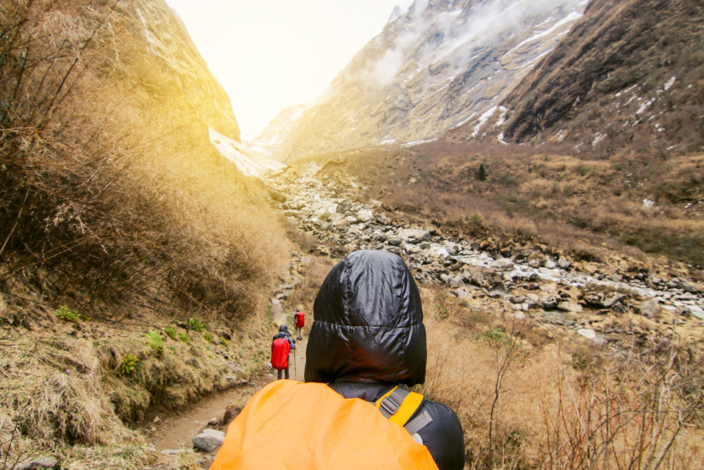 Woman backpacker traveling hiking in mountains Travel Lifestyle